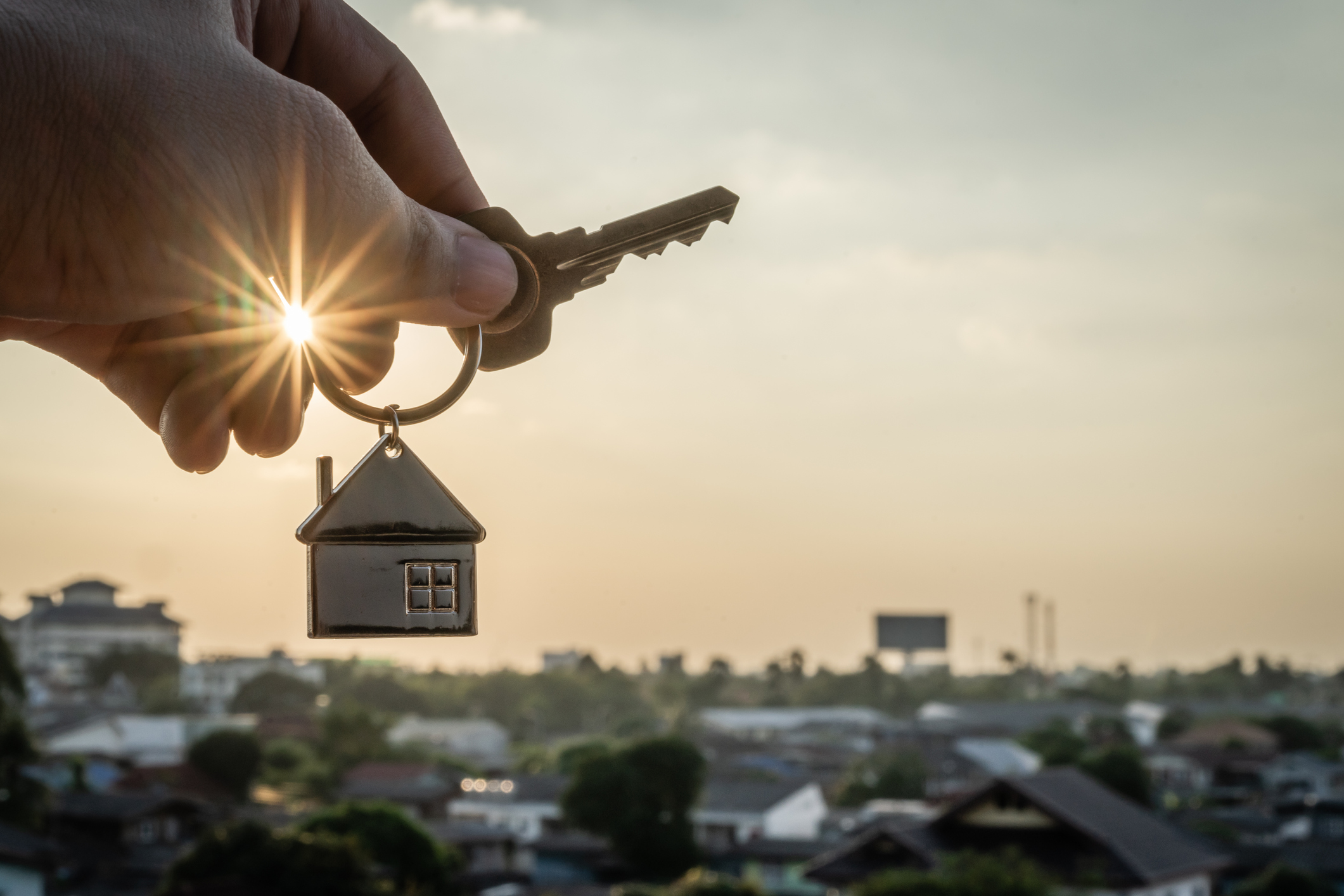 Couple holding keys to a new home